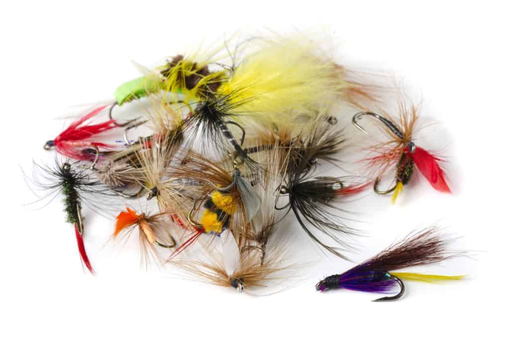 trout flies in a big pile nymphs, streamers, and dry flies